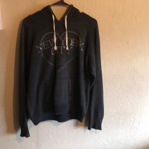 A dark gray sweater this is New York City